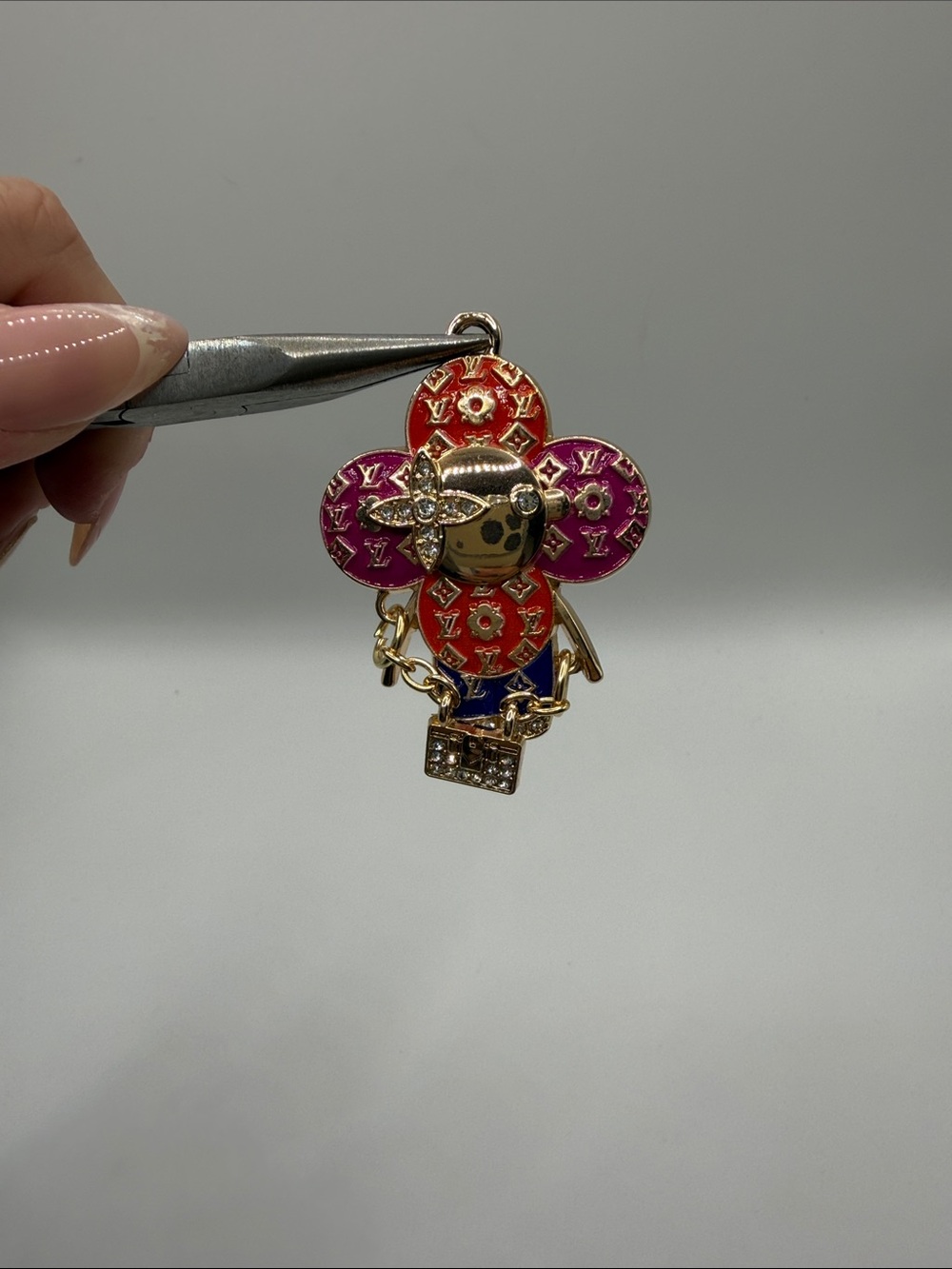 1423. Gold-Tone Vivi Charm in Red and Pink Enamel
